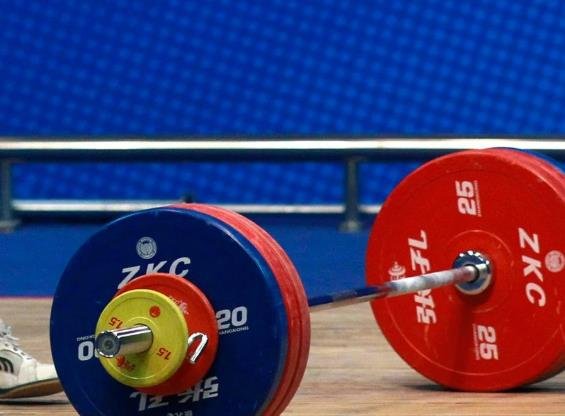 Iranian weightlifter faces lifetime ban for friendly gesture with Israeli rival