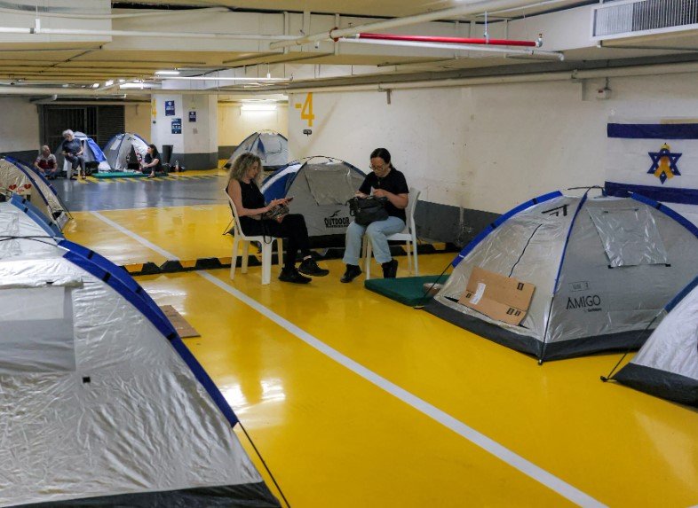 underground parking lot shelter israel iran missile war civilians