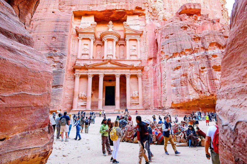 tourists in front of Petra treasury Jordan