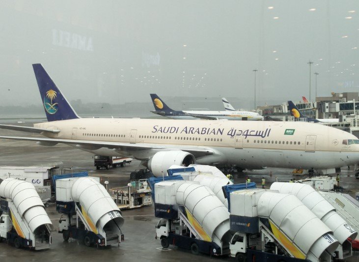 westjet saudia aircraft at airport gate