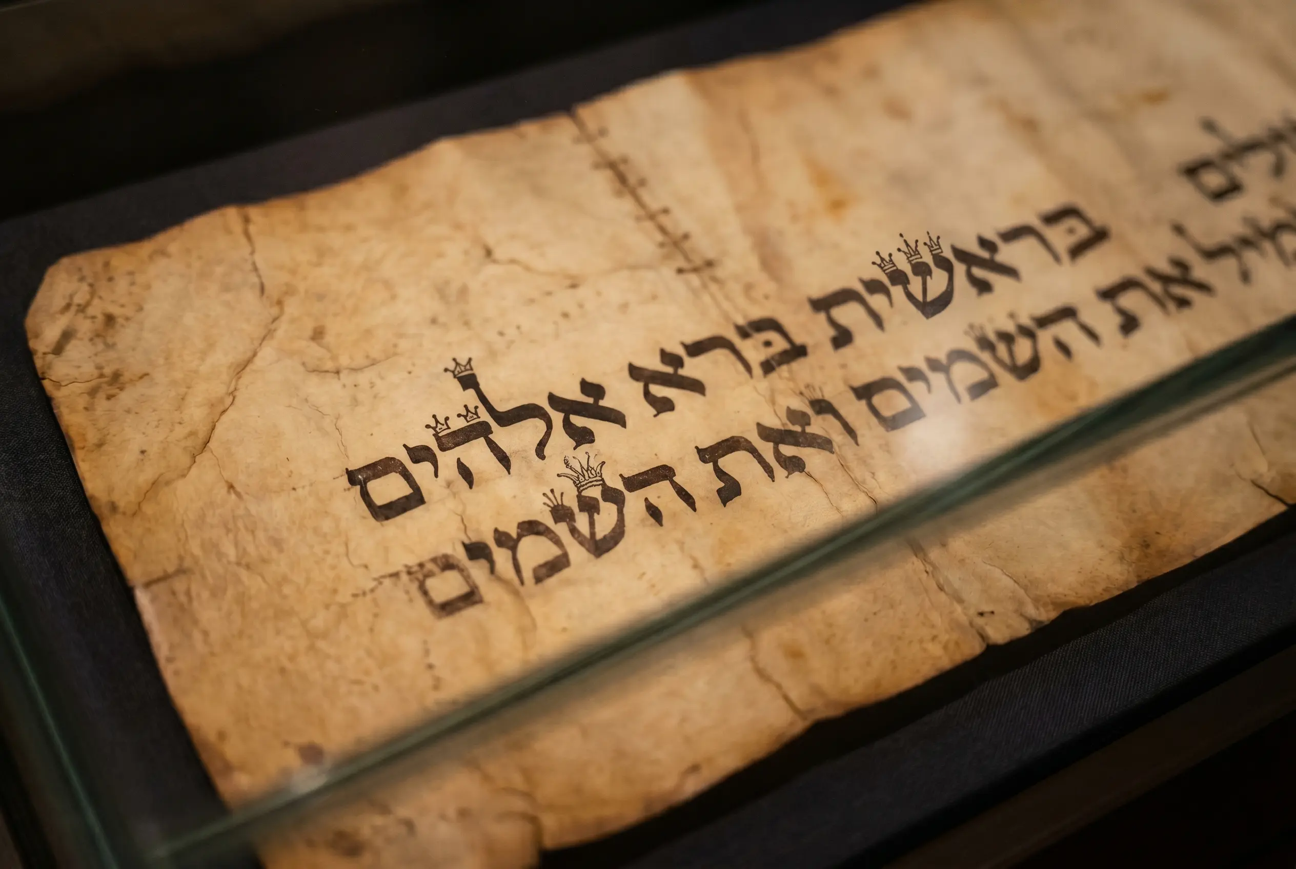 Medieval Sephardi Torah scroll leaves on display at Tel Aviv's ANU Museum.