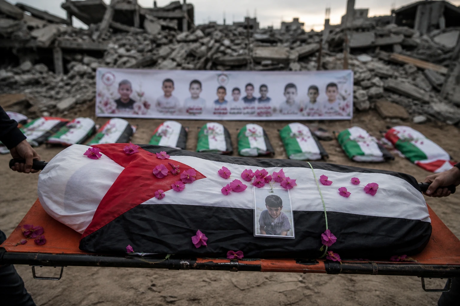 Gaza mass funeral 112 flag-draped remains Sabra attack recovery